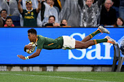 Springbok winger Canan Moodie goes over to score a try on debut in the Rugby Championship match against Australia at Allianz Stadium in Sydney on September 3 2022.