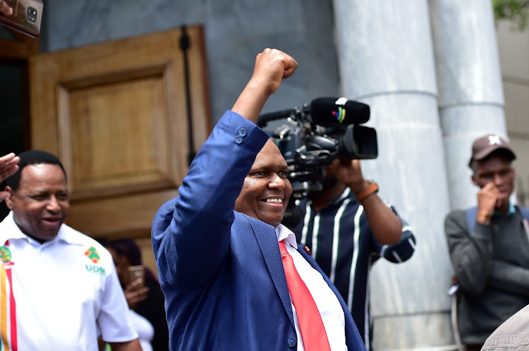 NOT BACKING DOWN: Former Bay mayor Mongameli Bobani looks confident outside the Port Elizabeth High Court on Friday. Bobani, who was unseated in a council meeting last week, and former acting city boss Nobuntu Mpongwana are asking the court to reinstate them