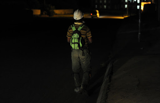 A miner during a rescue operation at Kusasalethu gold mine on February 22, 2015 in Cartlonville, South Africa.