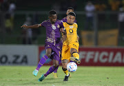 Keagan Dolly of Kaizer Chiefs is challenged by Kabelo Mahlasela of Royal AM in the Nedbank Cup match at Chatsworth Stadium in Durban on 16 April 2023.