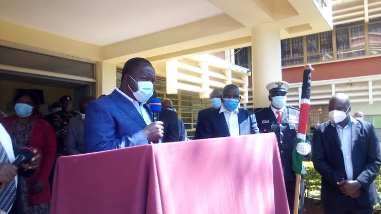 Interior CS Fred Matiangi addresses residents outside the County Commissioners office in Nyamira town on Monday, August 31, 2020.