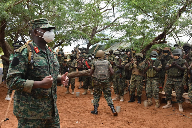 Commander of the Land Forces (CLF) of the Uganda People’s Defence Forces (UPDF), Lieutenant General, Muhoozi Kainerugaba, interacts with Ugandan soldiers serving under the African Union Mission in Somalia (AMISOM) at the Barawe Forward Operating Base (FOB) in the Lower Shabelle region of Somalia on 25 September 2021.