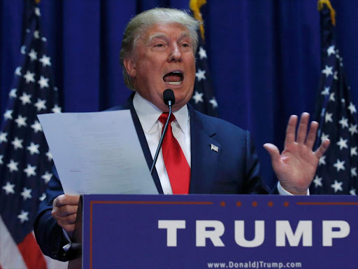 US Republican presidential candidate, real estate mogul and TV personality Donald Trump holds his financial statement while formally announcing his campaign for the 2016 Republican presidential nomination during an event at Trump Tower in New York June 16, 2015. Photo/REUTERS