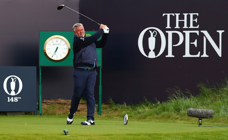 Darren Clarke of Northern Ireland plays the opening tee shot off the first tee during the first round of the 148th Open Championship held on the Dunluce Links at Royal Portrush Golf Club on July 18, 2019 in Portrush, United Kingdom.