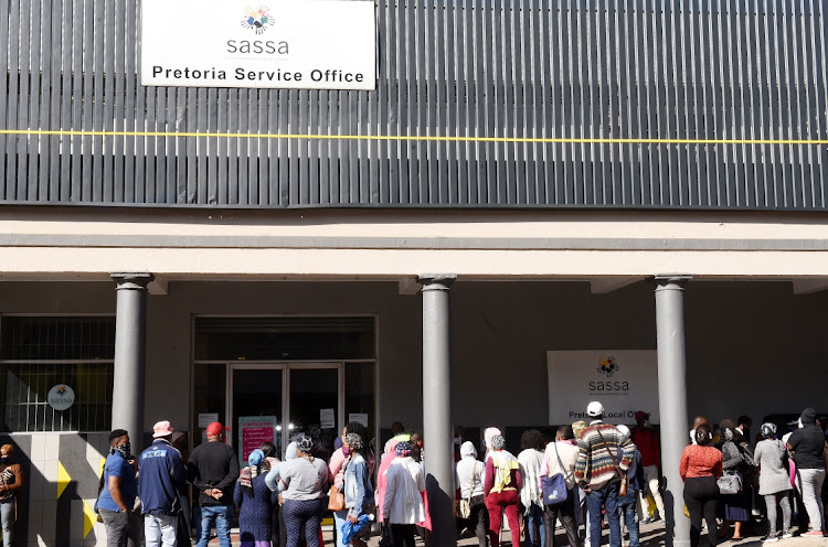 Residents queue for child support social grants at Sassa's Pretoria head office during the Covid19- lockdown in this file photo. Picture: FREDDY MAVUNDA