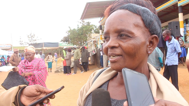 Resident Ann Mutua who recieved her title deed in Mwingi town on Tuesday, July 12.