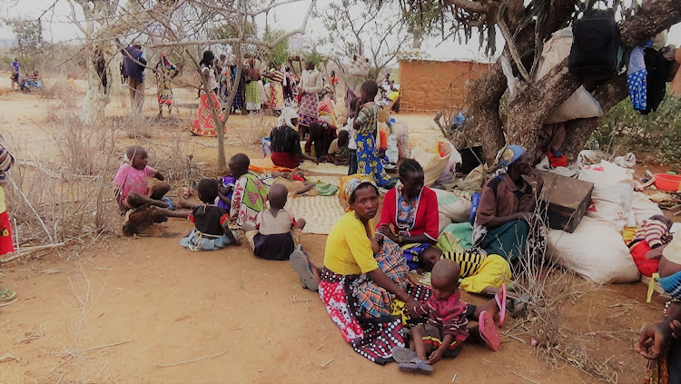 Displaced families at Imuumba police station on Tuesday after they fled their homes