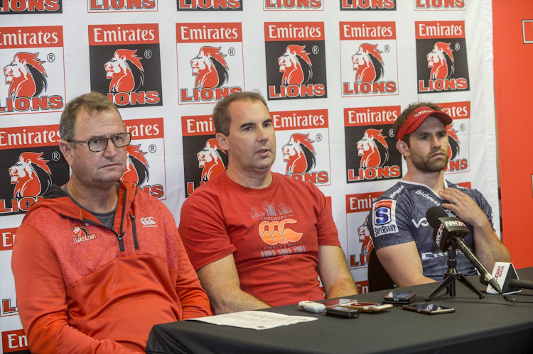 The Emirates Lions head coach Swys de Bruin (L) with Dr Rob Collins (C) and star player Nic Groom during a press conference.