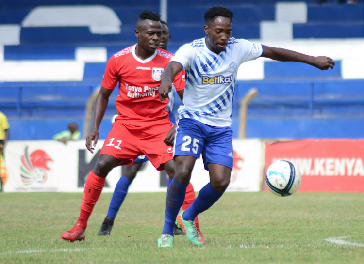 Sammy Imbuye of Sofapaka dribbles past Darius Msagha of Bandari