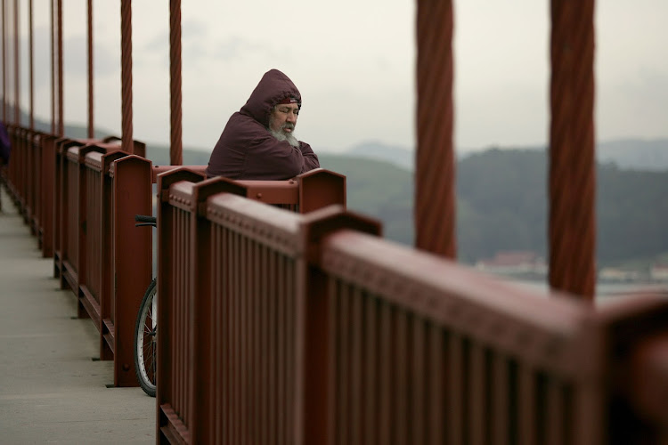 A man looks over the railing of the Golden Gate Bridge in San Francisco. Suicidal thoughts linked to a class of drugs used to treat diabetes and weight loss are a growing concern for pharmaceutical companies, the FDA and other drug governing bodies. Picture: JUSTIN SULLIVAN/GETTY IMAGES