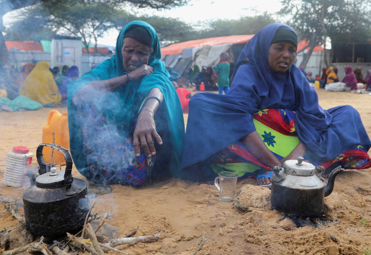 Somali women affected by the worsening drought due to failed rain seasons, prepare breakfast at the Alla Futo camp for internally displaced people, on the outskirts of Mogadishu, Somalia, in this September 23 2022 file photo. Picture: REUTERS/FEISAL OMAR.