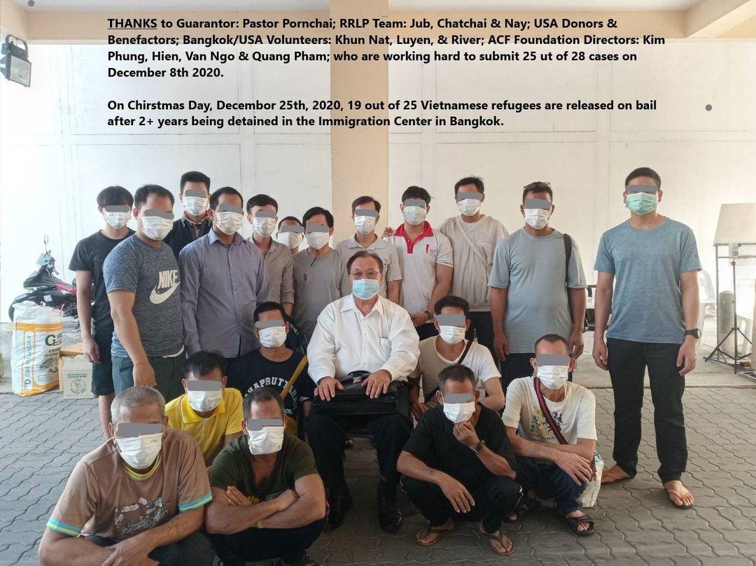 Image may contain: 1 person, standing, text that says 'THANKS to Guarantor: Pastor Pornchai; RRLP Team: Jub, Chatchai & Nay; USA Donors & Benefactors; Bangkok/USA Volunteers: Khun Nat, Luyen, River; ACF Foundation Directors: Kim Phung, Hien, Van Ngo & Quang Pham; who are working hard to submit 25 ut of 28 cases on December 8th 2020. On Chirstmas Day, Decembor 25th, 2020, 19 out of 25 Vietnamese refugees are released on bail after 2+ years being detained in the Immigration Center in Bangkok.'