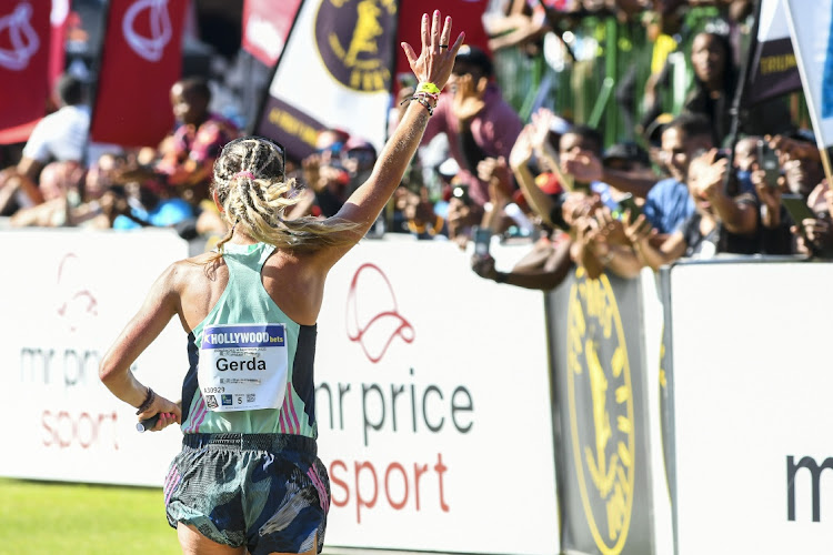 Gerda Steyn celebrates her Comrades Marathon victory at Kingsmead Stadium.