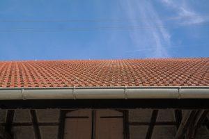 A well made roof with gutters.