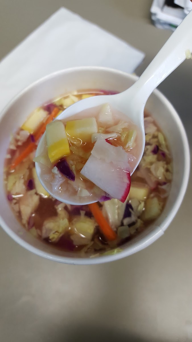 Bento soup with veggie broth, chicken, veggies, fresh ginger, and ginger lemongrass sauce.