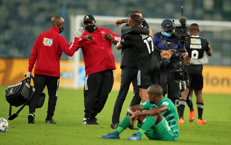 Josef Zinnbauer, coach of Orlando Pirates celebrates with Wayde Jooste of Orlando Pirates during the 2020 MTN8 final match between Bloemfontein Celtic and Orlando Pirates at Moses Mabhida Stadium, Durban, on 12 December 2020.