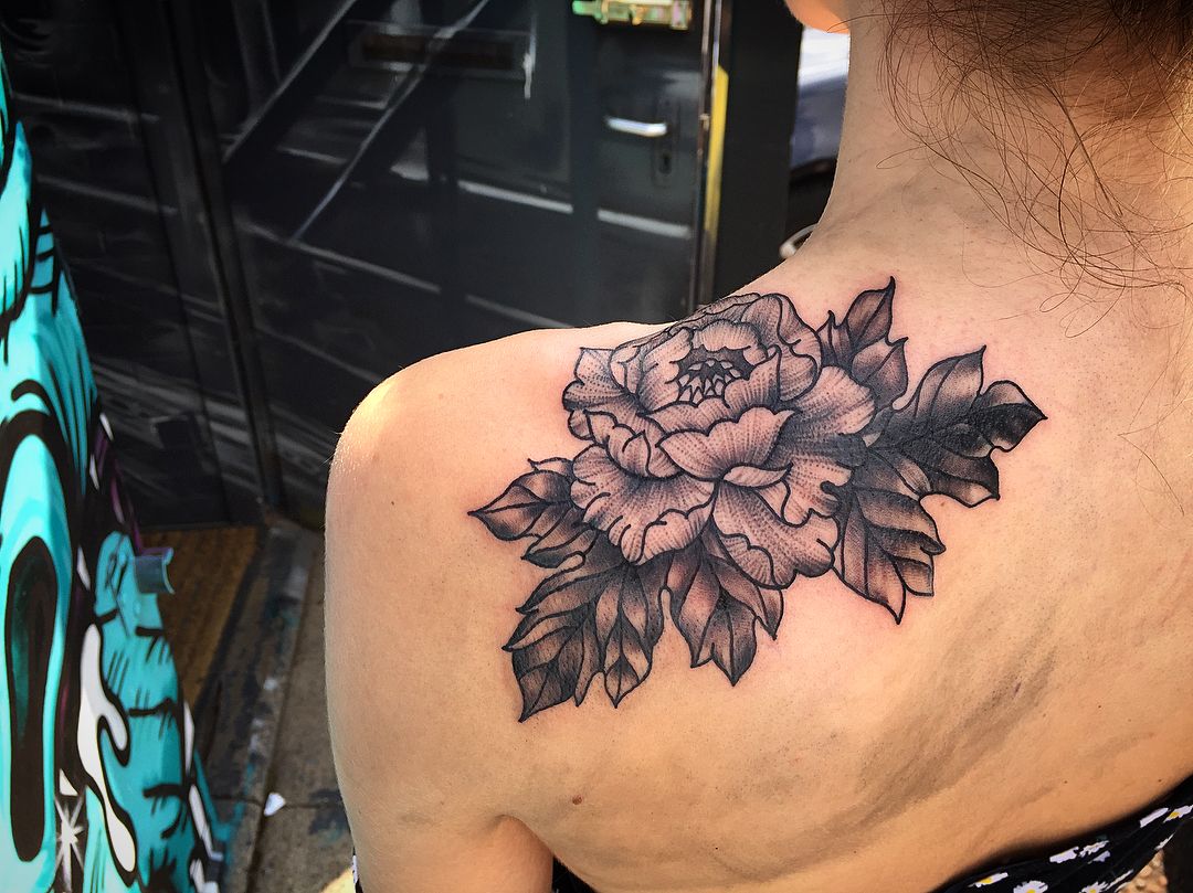 Black Flowers Tattoo On Back Shoulder