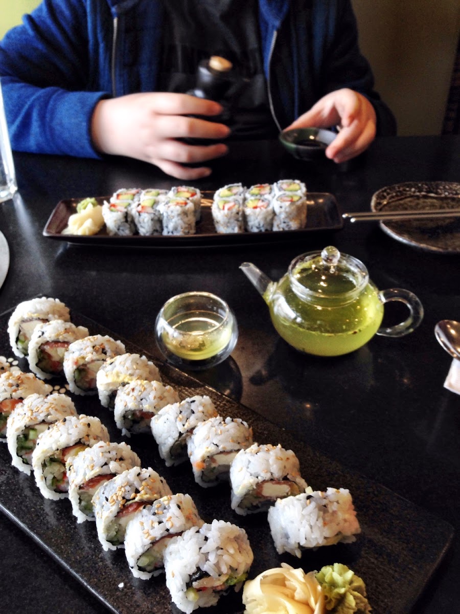 Gluten-free Philadelphia Rolls (smoked salmon, cream cheese and avocado) in the foreground.