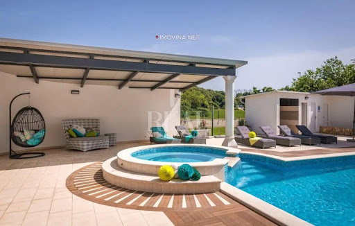 Pool with jacuzzi and outdoor furniture in this luxury house for sale in Pula ($15,702,970 - 565 m²)