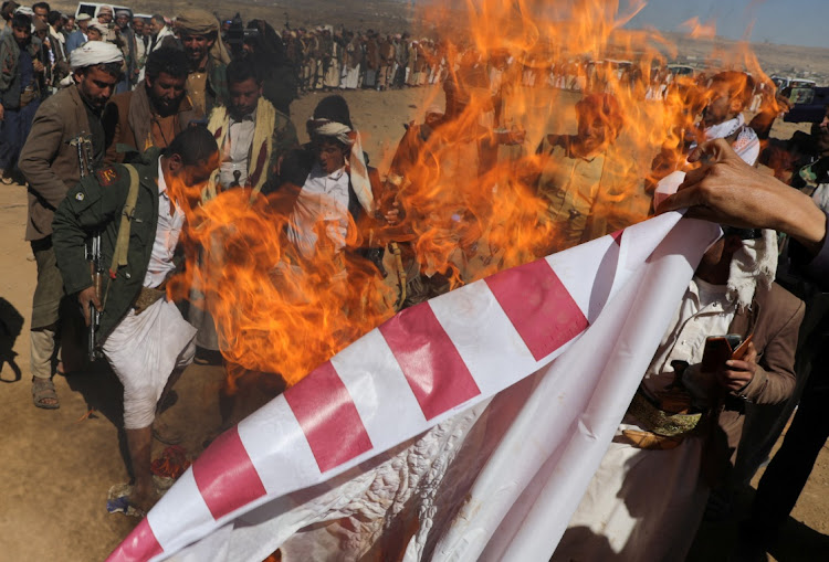 Tribal supporters of the Houthi group burn the US flag near Sanaa, Yemen, January 14 2024. Picture: KHALED ABDULLAH/REUTERS