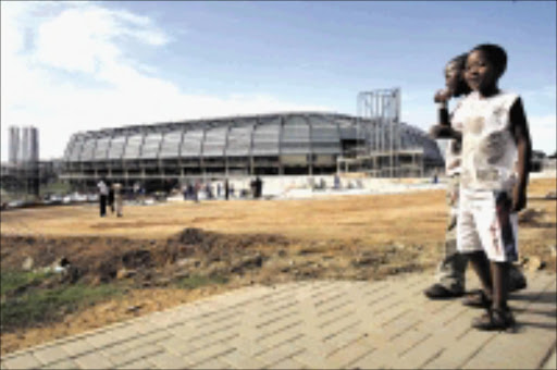 NEW - LOOK: Sowetans, young and old, are having a glimpse of the rebuilt Orlando Stadium. 18/11/2008. Pic. Antonio Muchave. © Sowetan