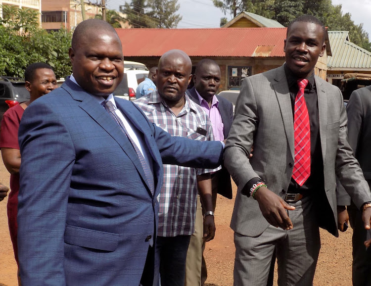 Kisii Deputy Governor Joash Maangi with lawyer Syivanus Osoro at Kisii Central police station recently.