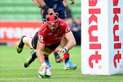 Lions' Warren Whiteley scores a try during the Super Rugby match between the Melbourne Rebels and Golden Lions at AAMI Park in Melbourne on May 6, 2017.