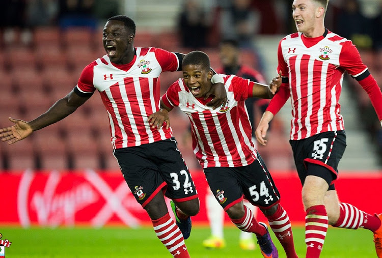 Siph Mdlalose (C) celebrates with his Southampton teammates.