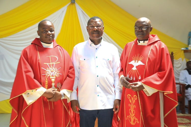 National Assembly Speaker Moses Wetang'ula with Fathers during a service at St. Stephen's Sikusi Catholic Church on December 26, 2023.