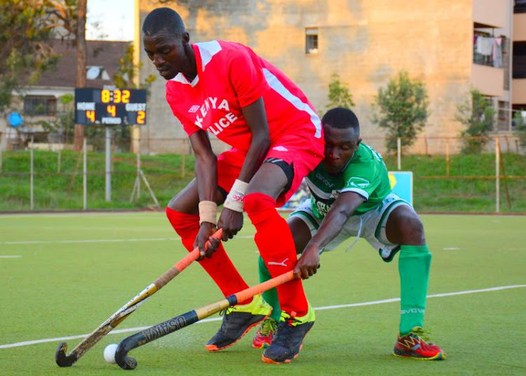 Samuel Oungo of Kenya Police (L) shields the ball from Chris Wokila of Greensharks in a past match