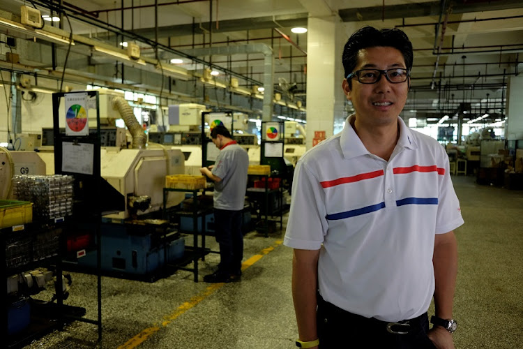 Allan Chau, General Manager of Tien Po International Limited, poses inside a factory in Dongguan, China April 10, 2018.