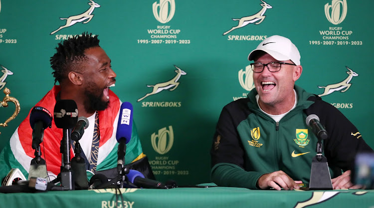 Springbok captain Siya Kolisi shares a joke with coach Jacques Nienaber at the press conference at OR Tambo International Airport on Tuesday after the team's return from winning the the 2023 Rugby World Cup.