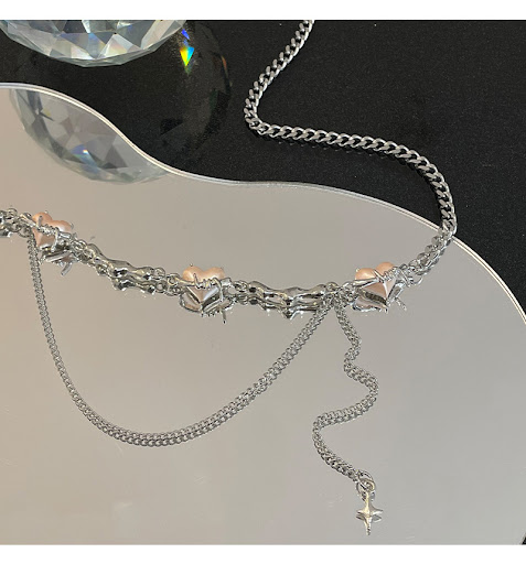 Title 3, Heart Shaped Thorn Tassel Necklace. A unique pi...