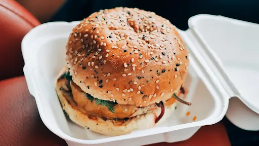 Schezwan Veg Burger With Cheese