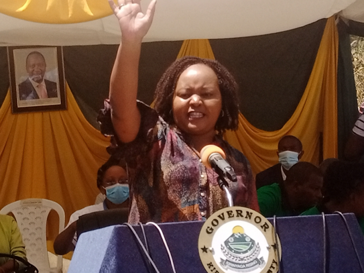 Kirinyaga county governor Anne Waiguru addressing Kanyeki-ini ward residents during an event to issue bursary and ECDE learning materials.