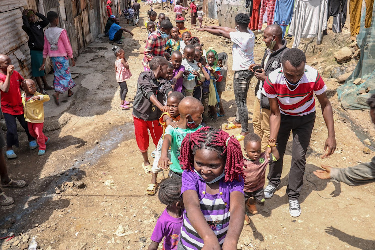 Mathare children line up for food shares