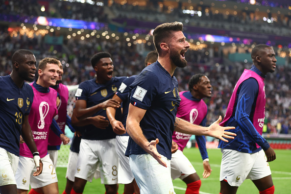 France striker Olivier Giroud celebrates with team-mates after he scored to make it 2-1 during the FIFA World Cup Qatar 2022 quarter final match against England at Al Bayt Stadium on December 10, 2022 in Al Khor, Qatar.