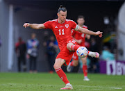 Gareth Bale of Wales controls the ball during the FIFA World Cup in Qatar last year. He has now retired from football.