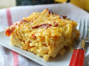 cheey potato breakfast casserole with cheddar and tomatoes