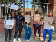 Family and friends of teenager Andile 'Bobo' Mbuthu, whose body was pulled from a river in KZN last month, at the Verulam magistrate's court on Thursday. They asked not to be named. 