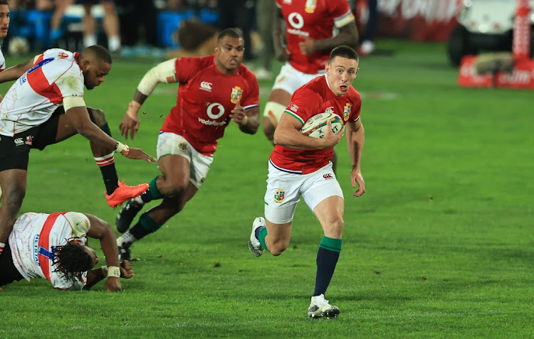 Josh Adams of the British and Irish Lions, who scored four tries in the match, breaks clear for his first touchdown against the homegrown Lions on Saturday