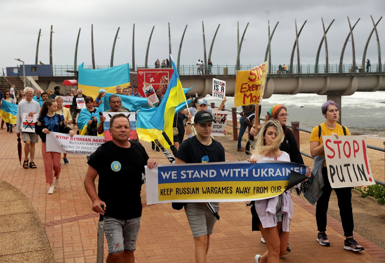 Protesters held banners showing solidarity with Ukraine as battles continue in the country against Russian forces.