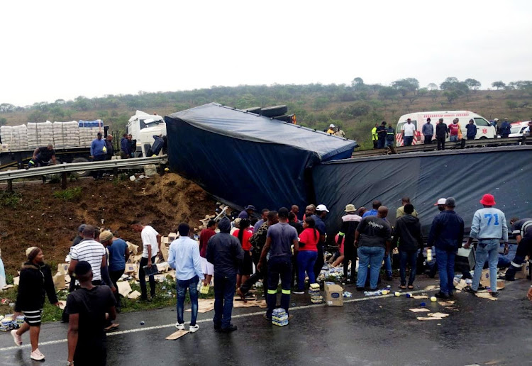 Goods that had fallen out of an overturned truck were looted on the N3 on Thursday.