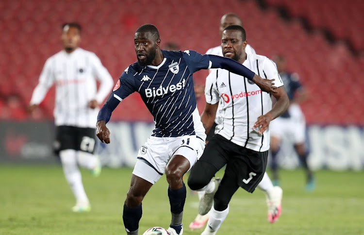 Deon Hotto of Bidvest Wits challenged by Ntsikelelo Nyauza of Orlando Pirates during the Absa Premiership match between Orlando Pirates and Bidvest Wits at Emirates Airline Park on August 15, 2020 in Johannesburg, South Africa.