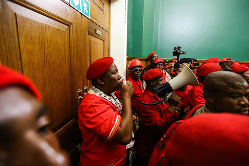 Members of the Economic Freedom Fighters wreaked havoc in the Johannesburg city centre yesterday when they stormed the Gauteng legislature, demanding that their members be allowed back into the house.