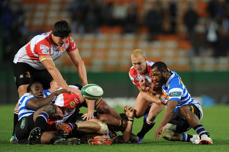 Sergeal Petersen of Western Province and Dillon Smit of the Lions look on as the ball evades them during a Currie Cup match at Newlands in Cape Town on July 27 2019.