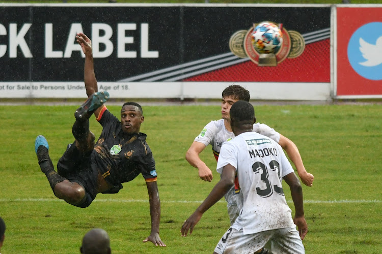 Royal AM striker Mxolisi Macuphu shoots at goal with an acrobatic strike which was swallowed by University of Pretoria goalkeeper Duminsani Msibi during the Nedbank Cup quarterfinal clash at Chatsworth Stadium in Durban on April 10 2022.