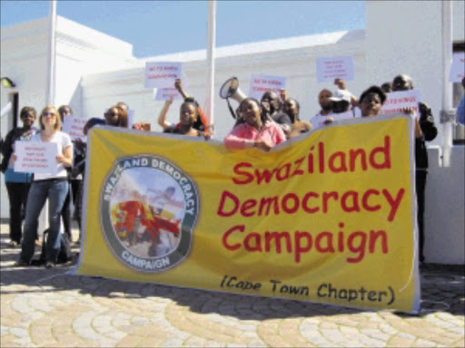 UPROAR: About 100 Swaziland democracy activists protested outside Parliament yesterday against the R2,4billion 'bailout' loan granted by the South African government to the Swazi government last month. PHOTO: ANNA MAJAVU