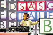 TALKING 'BOUT MY GENERATION: Three-year-old Oratile Hlongwane, known as DJ Arch Jnr, is the youngest DJ in the world, but you won't see him playing in clubs or parties until he has learnt the nine-times table. Oratile won 'SA's Got Talent' over the weekend Picture: e.tv