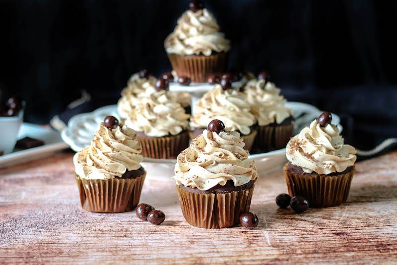 Espresso Cupcakes With Chocolate Shavings And Chocolate-covered Coffee Beans.